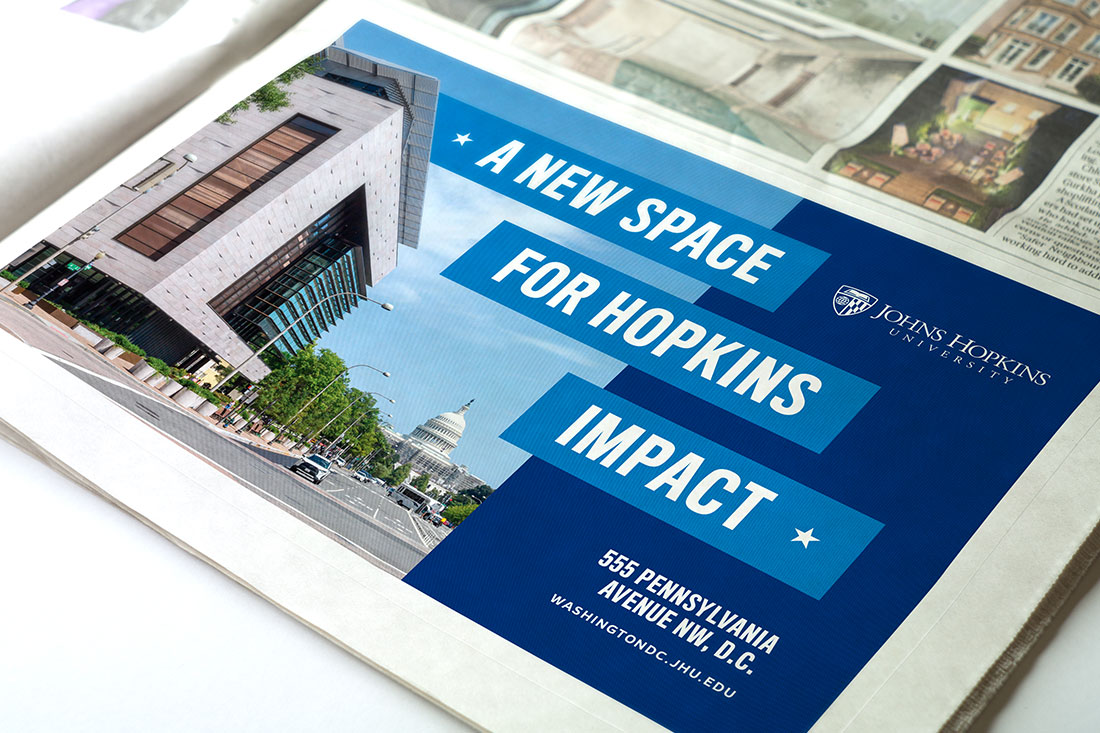A sample newspaper advertisement for Johns Hopkins University's newest D.C. location including an image of the building. The text reads: 'A New Space for Hopkins Impact, Bloomberg Center, 555 Pennsylvania Avenue NW, D.C.'