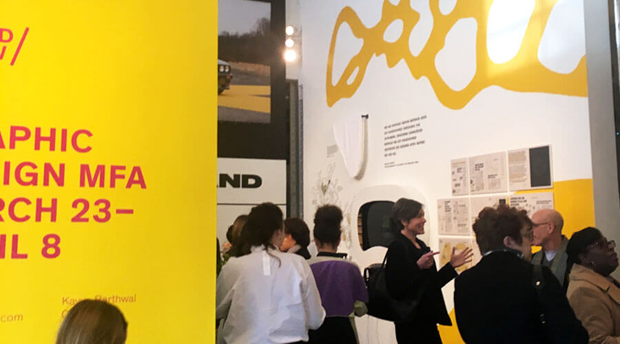 people mingling at MICA's public exhibition