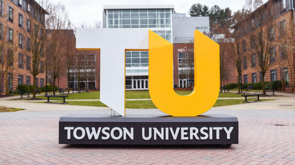 A life-size sculpture of the TU logo and wordmark.