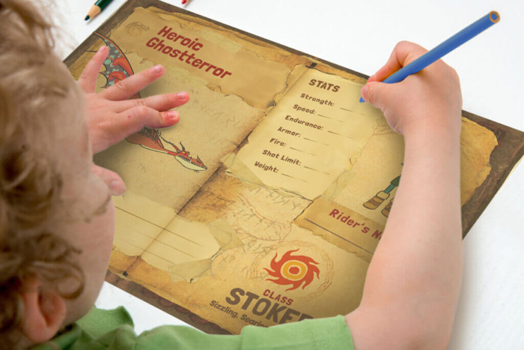 A child fills out a work booklet featuring dragons from the DreamWorks Dragons franchise.