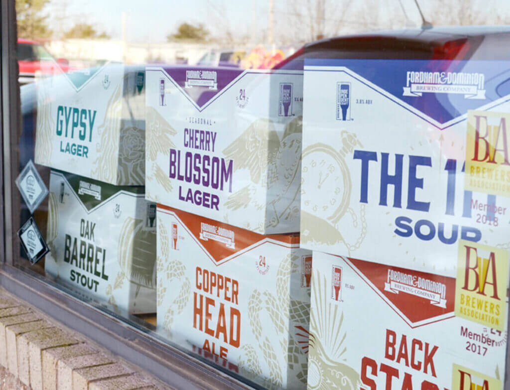 Branded boxes behind a window.