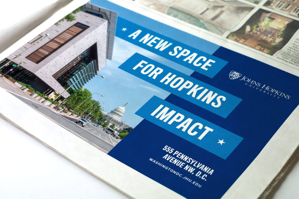A mocked-up newspaper advertisement featuring a key campaign message, “A New Space for Hopkins Impact.”